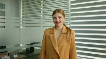 Portrait of business woman smiling on camera standing in office. video