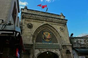 Istanbul, Turkey - February 2021. The entrance gate for The Grand Bazaar, Istanbul, which is first opened in 1461. One of the largest and oldest indoor markets in the world. photo