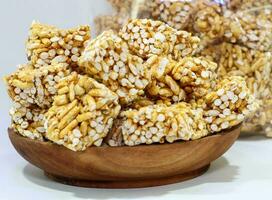 Rice popcorn or brondong, a traditional Indonesian food made from rice coated with sweet brown sugar photo