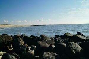 the endless beach at the northern sea Hvidbjerg Stranden Blavand Denmark photo