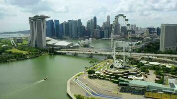 2020-01-02 SINGAPORE.Drone Aerial view 4k Footage of Gardens By The Bay, Flying Towards Skyline Singapore. Marina Bay In Singapore. Singapore Flyer video