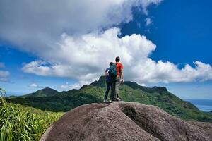 Mahe Seychelles 22.04.2023 Copolia trail Couple on the top part of the copolia trail looking at down at town victoria. photo