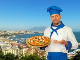 Pizza maker with margherita pizza in Naples. photo