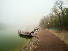 Foggy rainy autumn landscape with modern park in Zheleznovodsk w photo