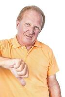 Handsome old man in orange polo-shirt shows thumb down photo