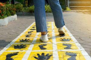 Follow the footsteps marked on the walkway compare footsteps It is a record of the virtue of a person who struggled. Overcome obstacles straight forward leaving traces for others to see and remember. photo