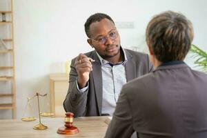 Law Consulting, Agreements, Contracts, African American attorneys provide legal advice and sign contracts as grievance attorneys for clients, Concept lawyers. photo