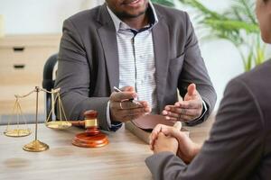 Law Consulting, Agreements, Contracts, African American attorneys provide legal advice and sign contracts as grievance attorneys for clients, Concept lawyers. photo