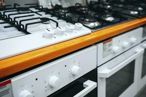 sale of gas cooktops in a home appliance store. built-in hob photo