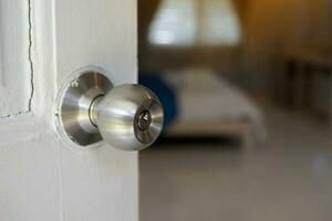 Entrance lock room door knob, When the door lock is pressed from the inside button can be unlocked using a key from the outside or twist the knob inside to unlock. Soft and selective focus. photo