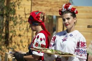 08 29 2020 Belarus, Lyakhovichi. City festival. Beautiful Slavic woman in embroidered shirt. photo