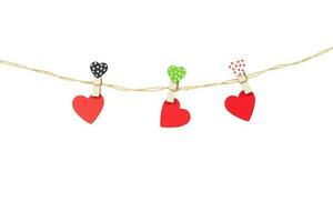 vHandmade three wood hearts hanging on cloth line or rope photo