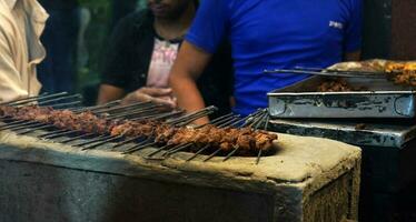 7th April 2023, Zakaria Street, Kolkata, West Bengal, India.Live Making of Seekh Kebab at Zakaria Street During Eid al-Fitr photo