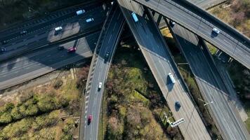 Vehicles Driving Along a Busy Motorway Interchange in the UK Aerial View video