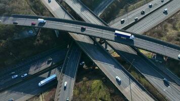 Vehicles Driving Along a Busy Motorway Interchange in the UK Aerial View video