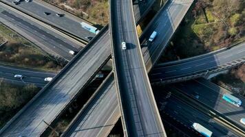 Vehicles Driving Along a Busy Motorway Interchange in the UK Aerial View video
