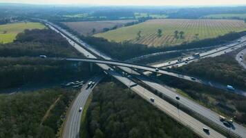 Vehicles Driving Along a Busy Motorway Interchange in the UK Aerial View video