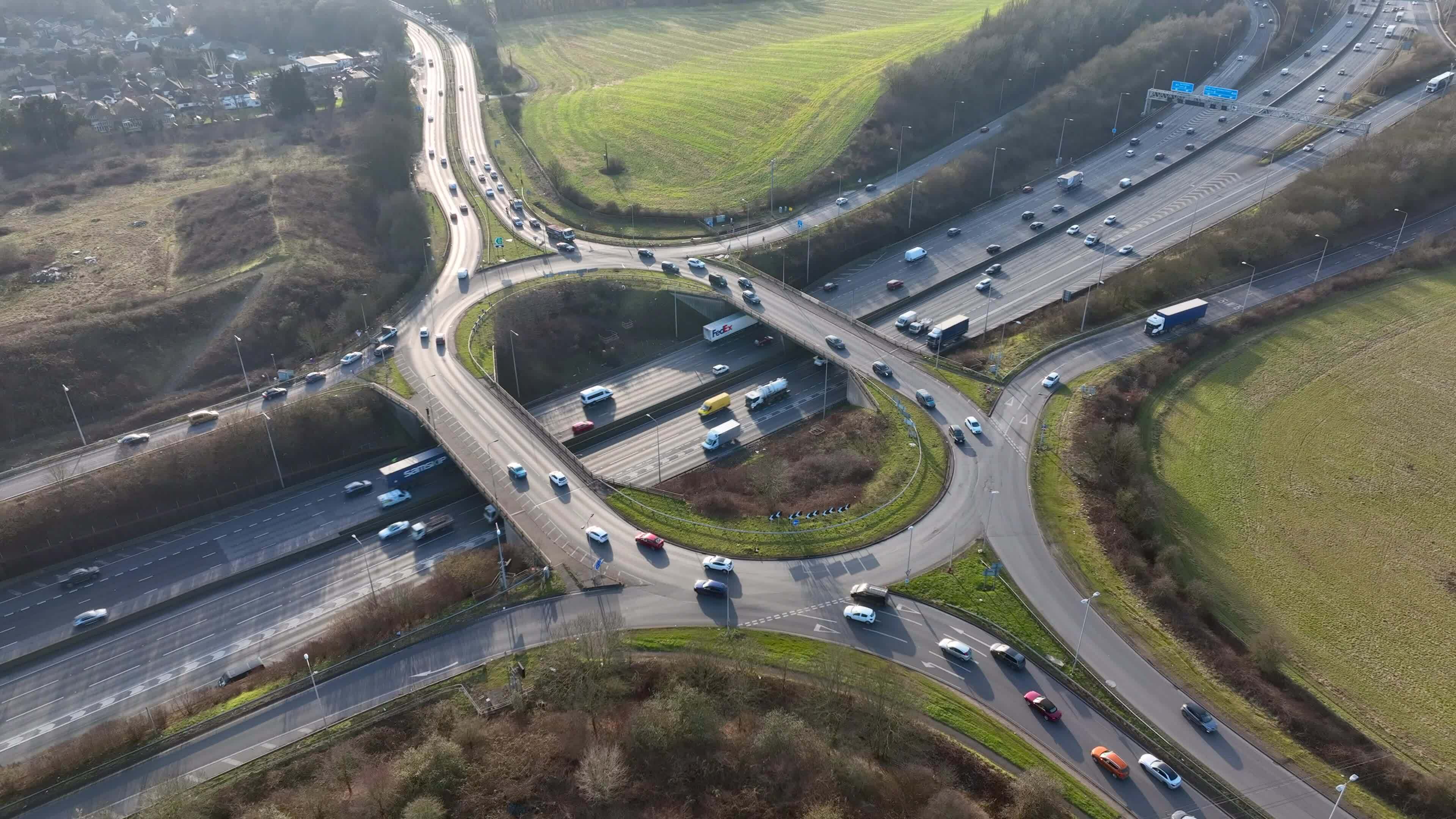 motorway-roundabout-junction-m25-time-lapse-at-rush-hour-23582894-stock