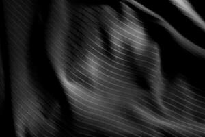 Dark black and gray blurred gradient and line of cloth or fabric background has a little abstract light. photo