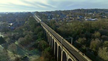 London Commuter Train in the UK Crossing a Viaduct in the Evening video