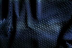 Dark black and gray blurred gradient and line of cloth or fabric background has a little abstract light. photo