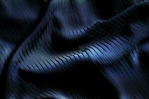 Dark black and gray blurred gradient and line of cloth or fabric background has a little abstract light. photo