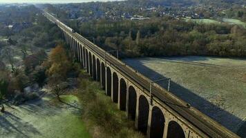 London Commuter Train in the UK Crossing a Viaduct in the Evening video