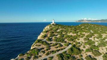 Lighthouse in Ibiza at the Top of a Tall Cliff Aerial View video