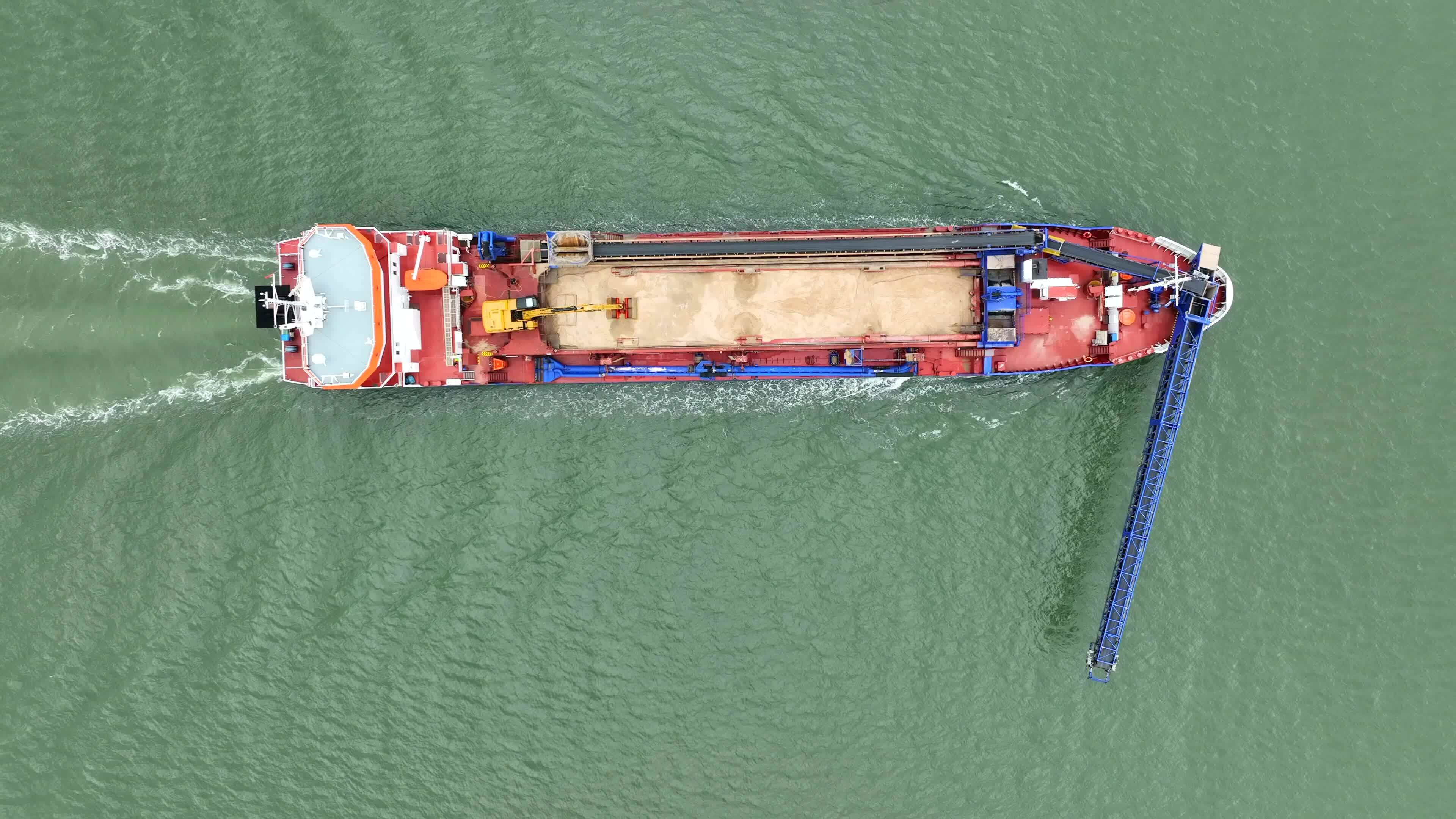 Bird's Eye View of a Self Unloading Barge Carrying Cargo At Sea 23585230 Stock Video at Vecteezy