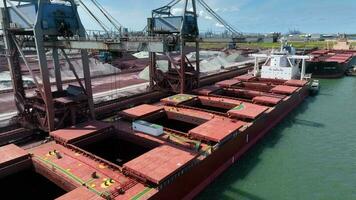 Bulk Carrier Ship Offloading Cargo By Crane for Processing video