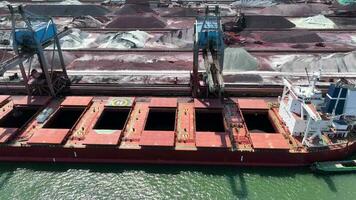 Cranes Unloading a Bulk Carrier Ship at Port video