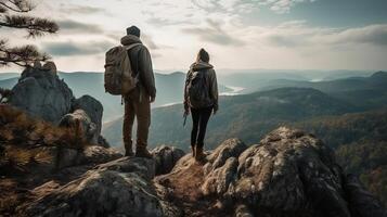 A man and a lady in traveler hardware are standing on a shake and with respect to the all encompassing see. Creative resource, photo