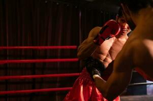 Punching is one of the master techniques of Muay Thai that is used to kick and lift to prevent kicks. which boxers are popularly used as weapons, Muay Thai,Thai martial arts. photo
