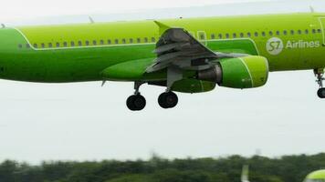 NOVOSIBIRSK, RUSSIAN FEDERATION JULY 15, 2022 - Plane Airbus A320 214, RA 73420 of S7 Airlines approaching before landing, side view. Airplane flies. Tourism and travel concept video