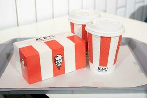 Yerevan, Armenia  April 25, 2023 KFC fried chicken bucket and drinks photo