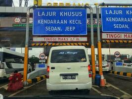 Cikampek, Indonesia in November 2022. The queue of cars that will enter the Cikampek Utama toll gate. photo