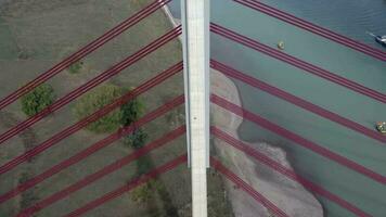 Aerial View of a Cable Stayed Suspension Bridge Crossing a River video