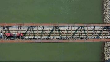 Bird's Eye View of a Freight Train Crossing A Bridge video