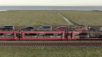 Moto Rail Train Carrying Vehicles and Passengers on a Journey video