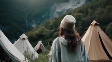 Travel. back see Excited lady voyages through the mountains glamping, tents,waterfalls of wild nature. photo