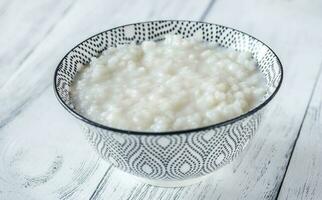 Bowl of congee - Asian rice porridge photo