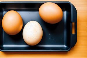 Eggs in a tray on a white background, top view. photo