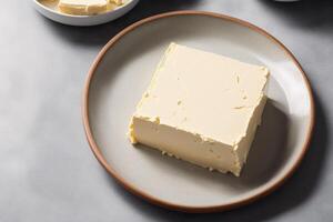 Fresh butter on a plate, close-up. photo