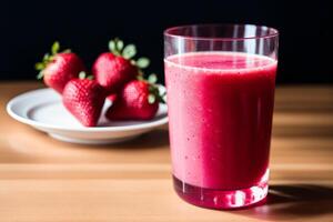 Fresh strawberry smoothie in a glass on a wooden table., closeup. Healthy food concept. photo