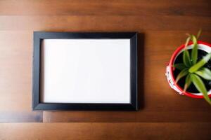 Photo frame on the wooden table. Blank wooden photo frame. Mock up.