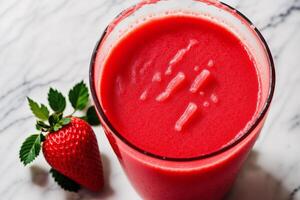 Fresh strawberry smoothie in a glass on a wooden table., closeup. Healthy food concept. photo