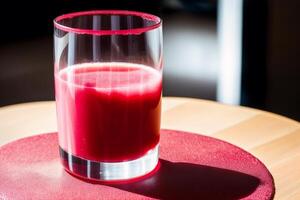 Fresh strawberry smoothie in a glass on a wooden table., closeup. Healthy food concept. photo