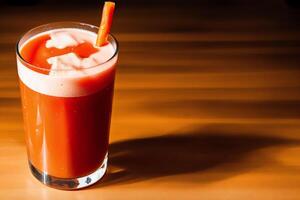 Carrot juice in a glass with fresh carrots on a dark background. close up. Healthy food concept. photo