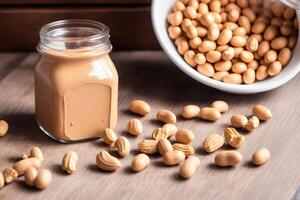 Peanut butter in a glass jar with peanuts on a wooden background. healthy food concept. photo