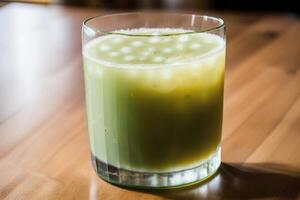 Cucumber smoothie in a glass on a black background. Green smoothie with lime and mint. Healthy food concept. photo